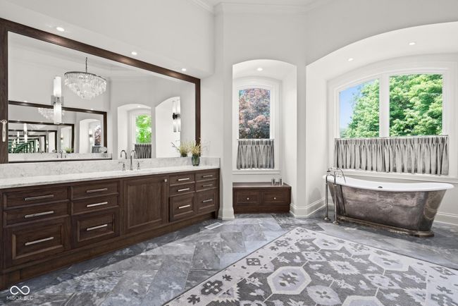 primary bathroom featuring two vanities, healthy amount of natural light | Image 30