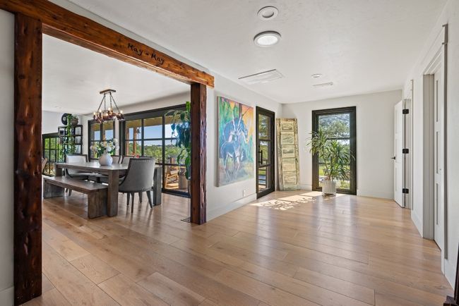 Entryway with a chandelier and light wood finished floors | Image 31