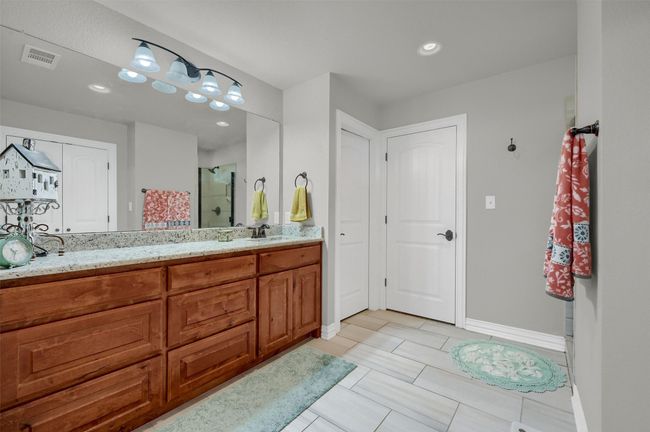 Bathroom with vanity, a shower stall, baseboards, visible vents, and recessed lighting | Image 19