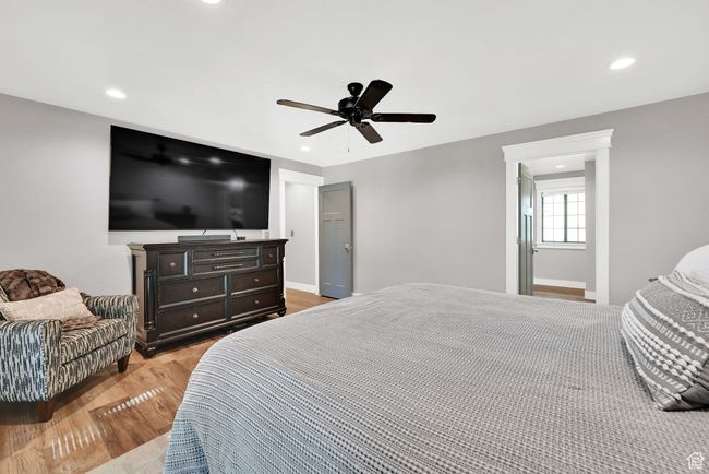 Bedroom featuring light wood-type flooring and ceiling fan | Image 20