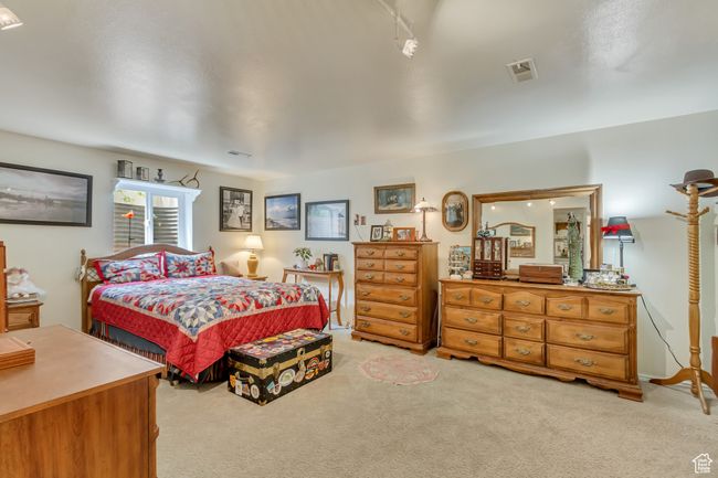 Bedroom with light carpet and visible vents | Image 41