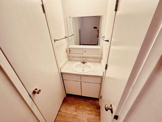Bathroom featuring wood finished floors and vanity | Image 7