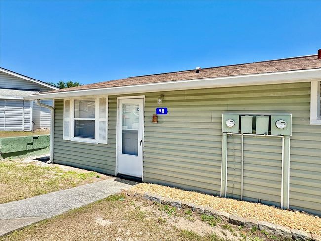 Front view of unit 98 with reserved parking right in front of unit. NO stairs | Image 35