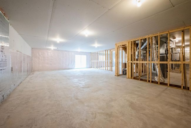Photo of actual home. Unfinished walkout lower level | Image 15