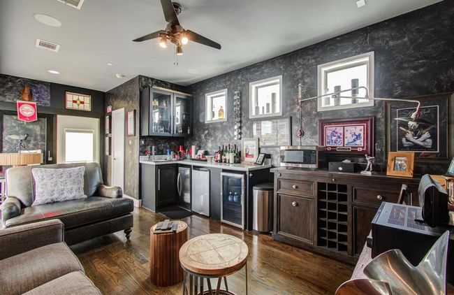 This 4th floor space has a bar sink, storage and plenty of space for a sectional or game table. | Image 31