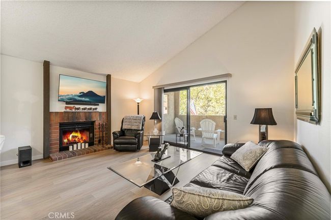 Sliding doors to the large patio deck with a view. You can also se your parking spot. | Image 6