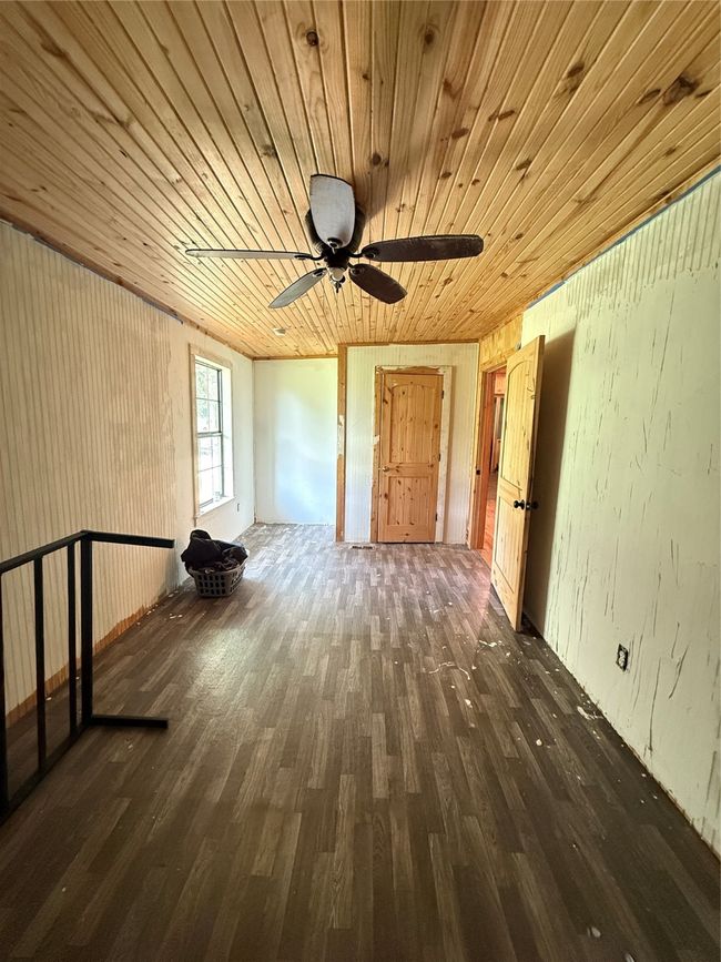 Spare room with wood finished floors, ceiling fan, and wooden ceiling | Image 33