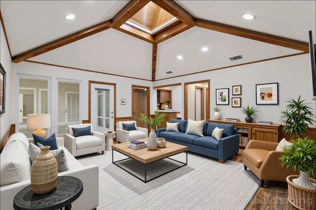 Second Living room featuring Motorized Skylight with Remote-Controlled Shade, beamed ceiling, light wood finished floors, high vaulted ceiling, and recessed lighting. | Image 10