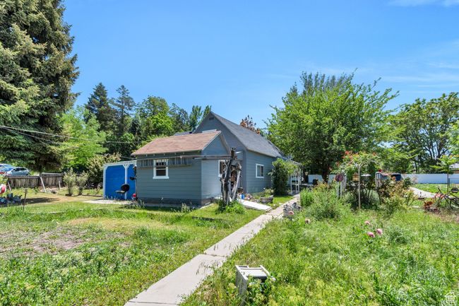 View of side of property featuring an outdoor structure | Image 12