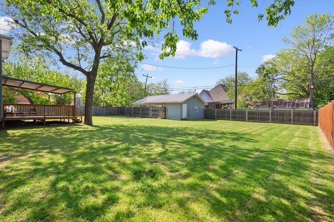 View of yard featuring a fenced backyard and a wooden deck | Image 34