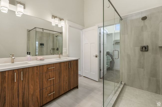 Sophisticated primary bath showcasing a dual-sink vanity and generous counter space. | Image 14