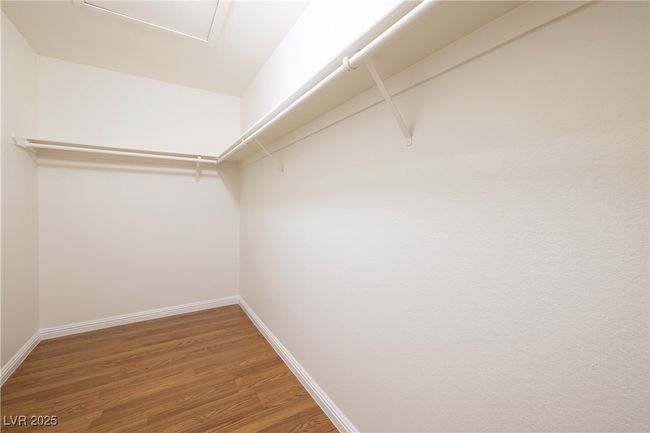 Spacious closet featuring wood finished floors | Image 13