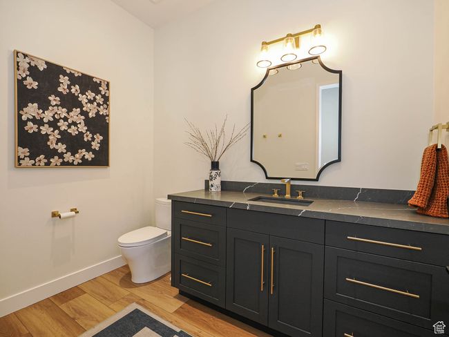 Bathroom with vanity and wood finished floors | Image 86