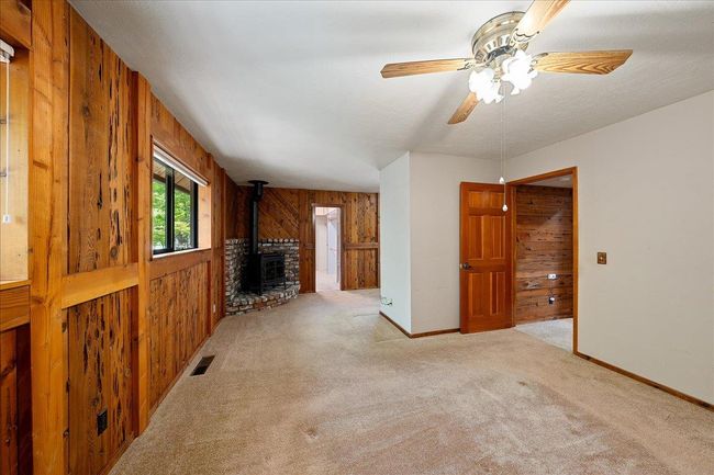 Cozy gas log fireplace in master bedroom. | Image 37