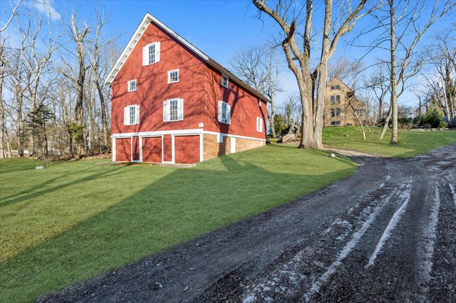 View of property exterior with a garage and a lawn | Image 5
