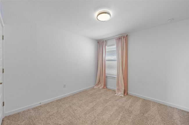 Unfurnished room featuring light colored carpet and baseboards | Image 28