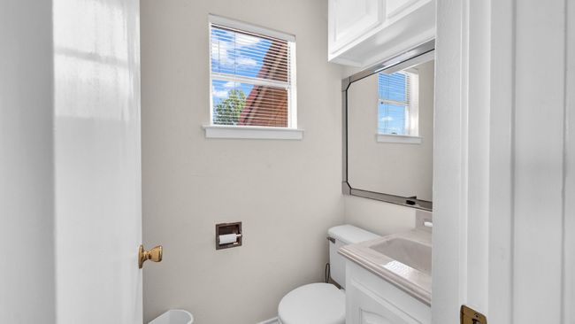 Bathroom with toilet and vanity | Image 18
