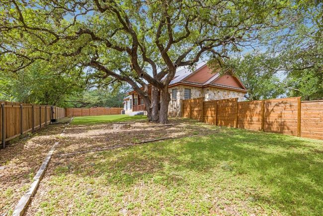 The view of the back yard from the back right fenced portion of the back yard. | Image 31