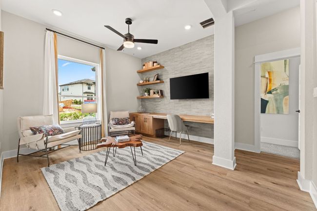 This flexible space can serve as a home office, playroom, workout area, or guest lounge. | Image 12