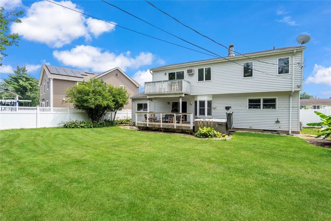 Back of house with a wooden deck and a balcony | Image 35