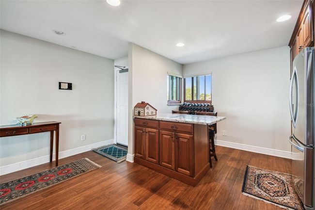 Another view of the transient island counter with sitting area. | Image 14