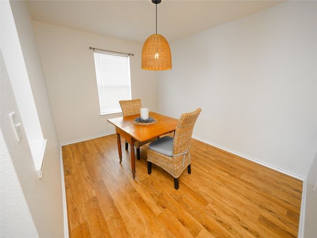 Dining room with baseboards and light wood-type flooring | Image 13
