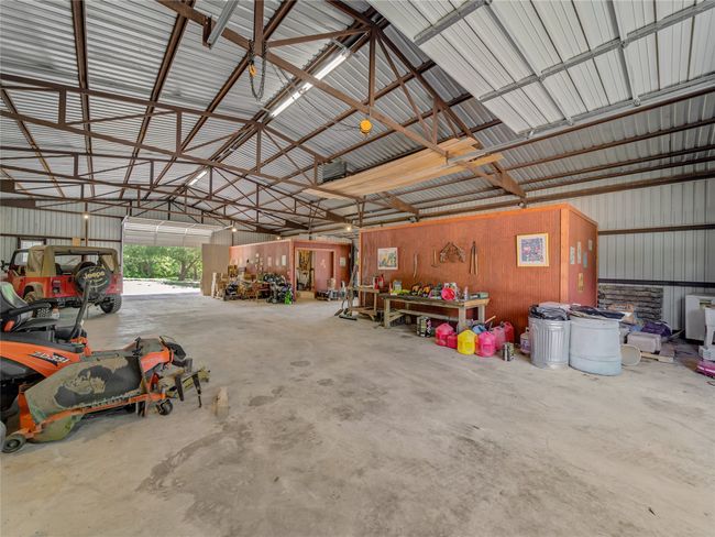 Interior of the shop barn with tractor storage | Image 7