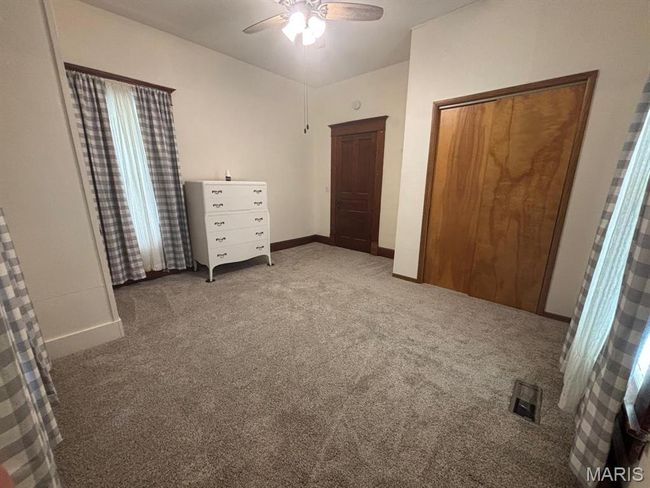 Unfurnished bedroom featuring carpet and a ceiling fan | Image 19