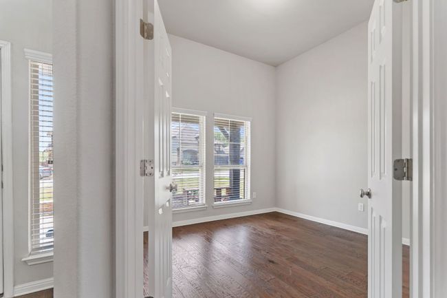 Office with dark wood-style floors and baseboards | Image 9