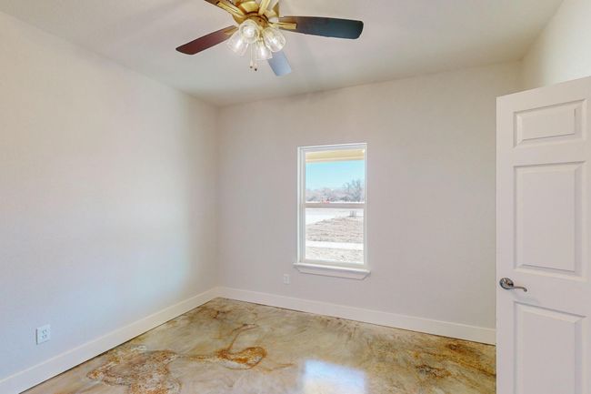 Spare room with concrete flooring and ceiling fan | Image 22