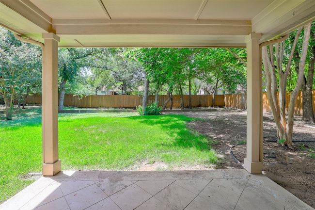 Fenced backyard featuring a covered patio | Image 9