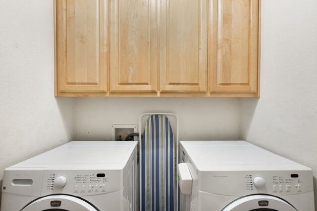 Laundry room with washer and clothes dryer and cabinet space | Image 15