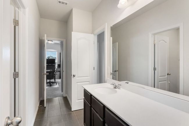 This bathroom is between the 2 bedrooms on the second floor. It does have a separate door that leads to the game room. | Image 23