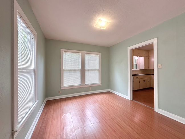 Unfurnished room featuring wood finished floors and baseboards | Image 18