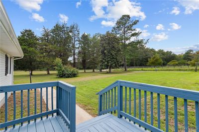 Deck featuring a lawn | Image 3