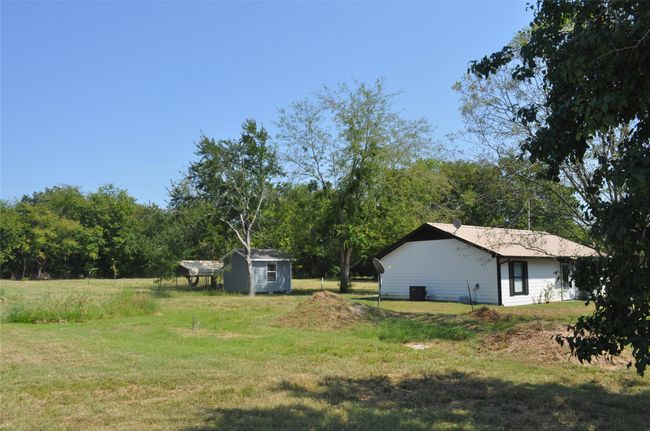 View of yard with a shed | Image 21