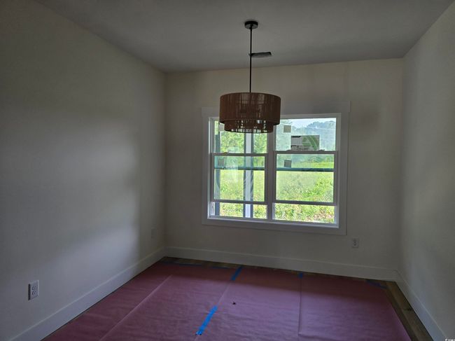 Unfurnished dining area featuring baseboards | Image 14