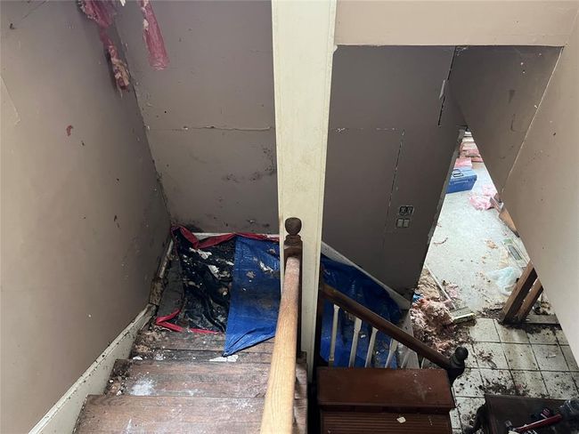 Looking down the stairs at the area of the leak. | Image 30