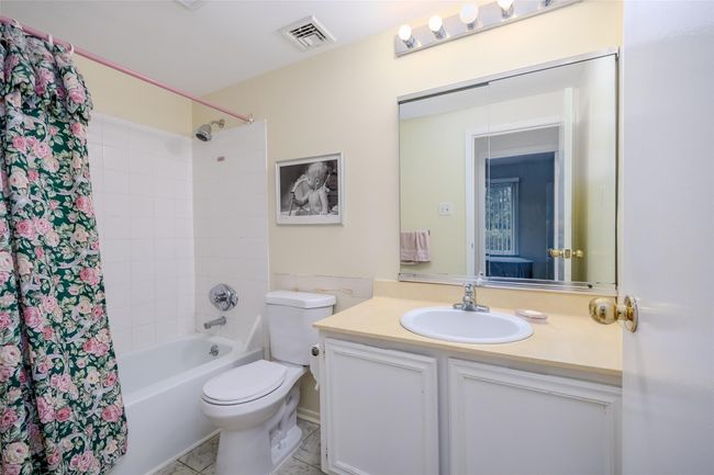 Laundry room featuring washing machine and dryer and light floors | Image 31
