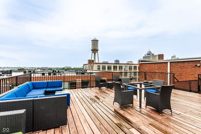 wooden deck featuring an outdoor living space and outdoor dining space | Image 33