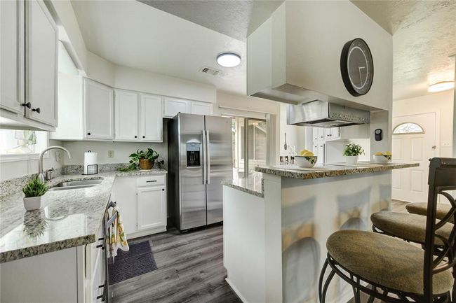 Imagine sitting at the spacious breakfast bar, entertaining friends and family with ease | Image 19