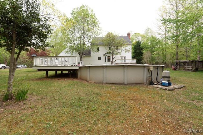 Rear view of house with the above ground pool | Image 11