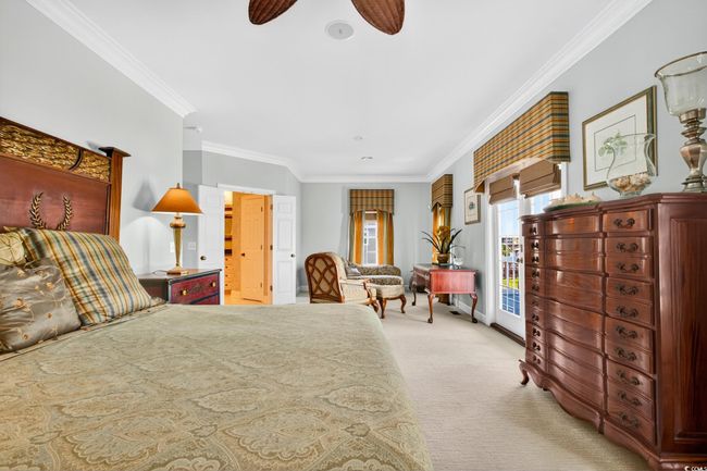 Bedroom featuring light carpet, crown molding, access to outside, and a ceiling fan | Image 24