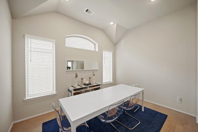 This thoughtfully designed homeseamlessly connects the kitchen witha charming dining room. | Image 11
