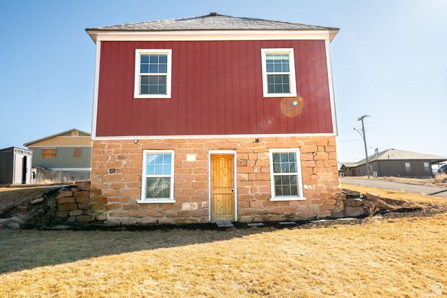 View of front facade featuring a shingled roof and a front yard | Image 28