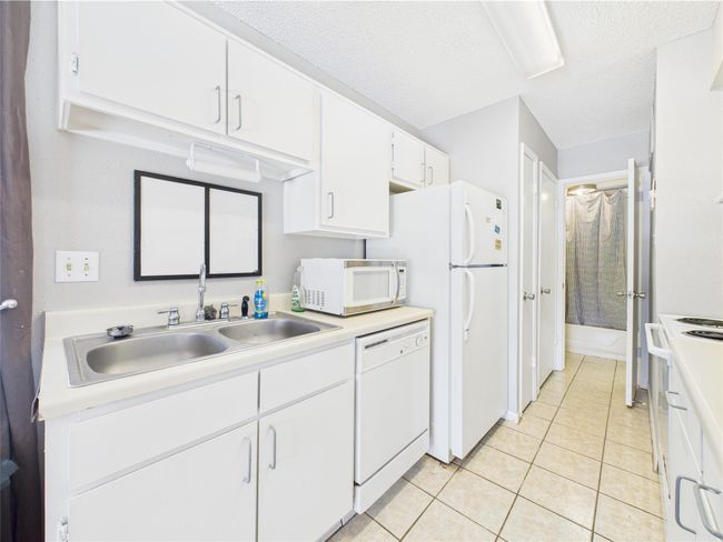 Galley Kitchen with Double Sink, DW & Refrigerator | Image 6