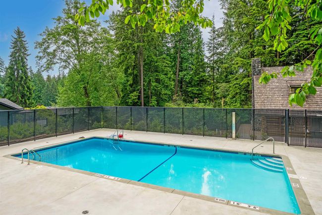 Community pool with a patio area | Image 24