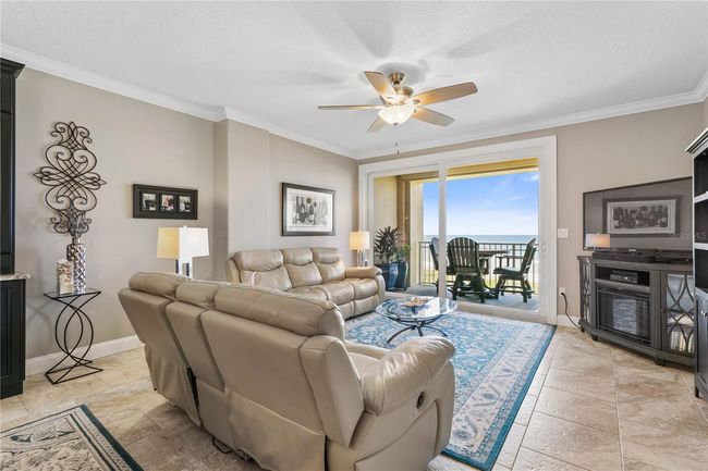 Spacious living with new paint and additional trim around doors and walls | Image 5