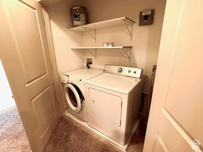 Laundry room with washer and dryer and carpet flooring | Image 13