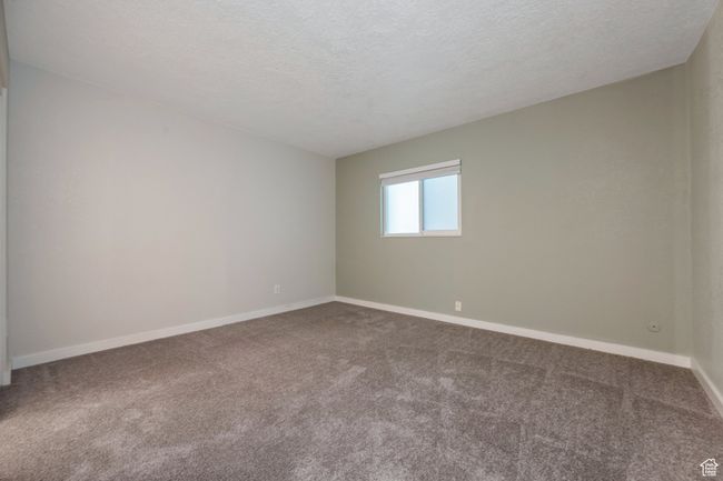 Spare room with carpet and a textured ceiling | Image 8